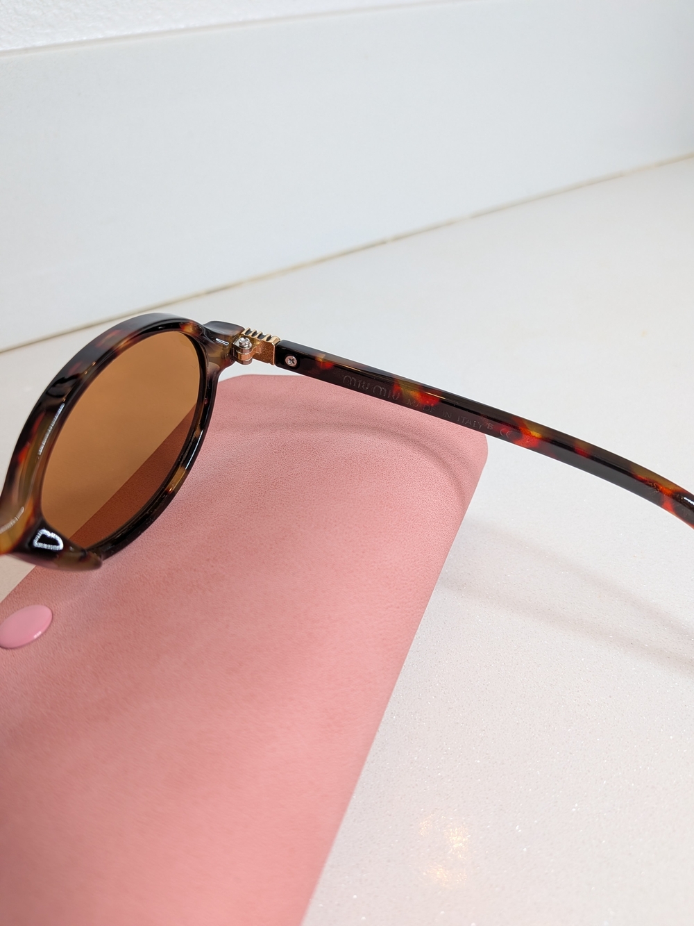 Miu Miu Tortoiseshell Oval Sunglasses in Brown - Picture 9 of 11